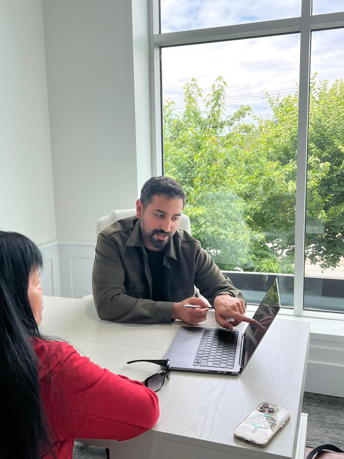 Dr. Randhawa in consultation with a patient