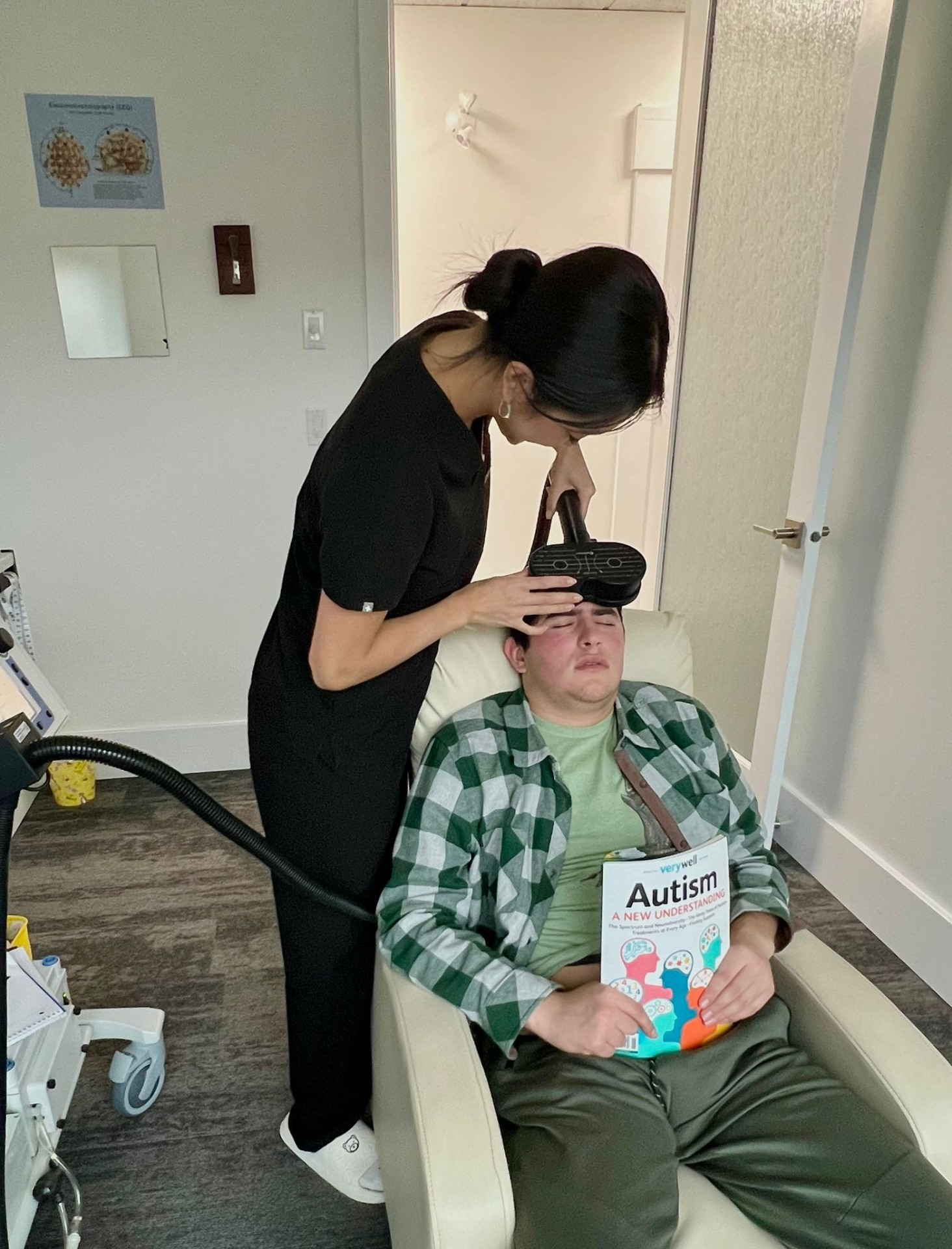 A clinician gently positioning the MeRT® coil during a session